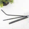 Black-Stainless-Steel-Straw-in-clear-glass,-top-view