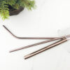 Rose-Gold-Stainless-Straws-in-clear-glass,-top-view